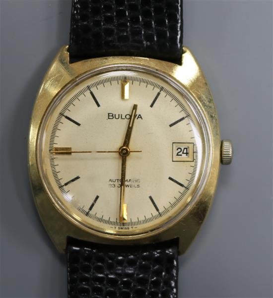 A gentlemans 9ct gold Bulova automatic wrist watch.